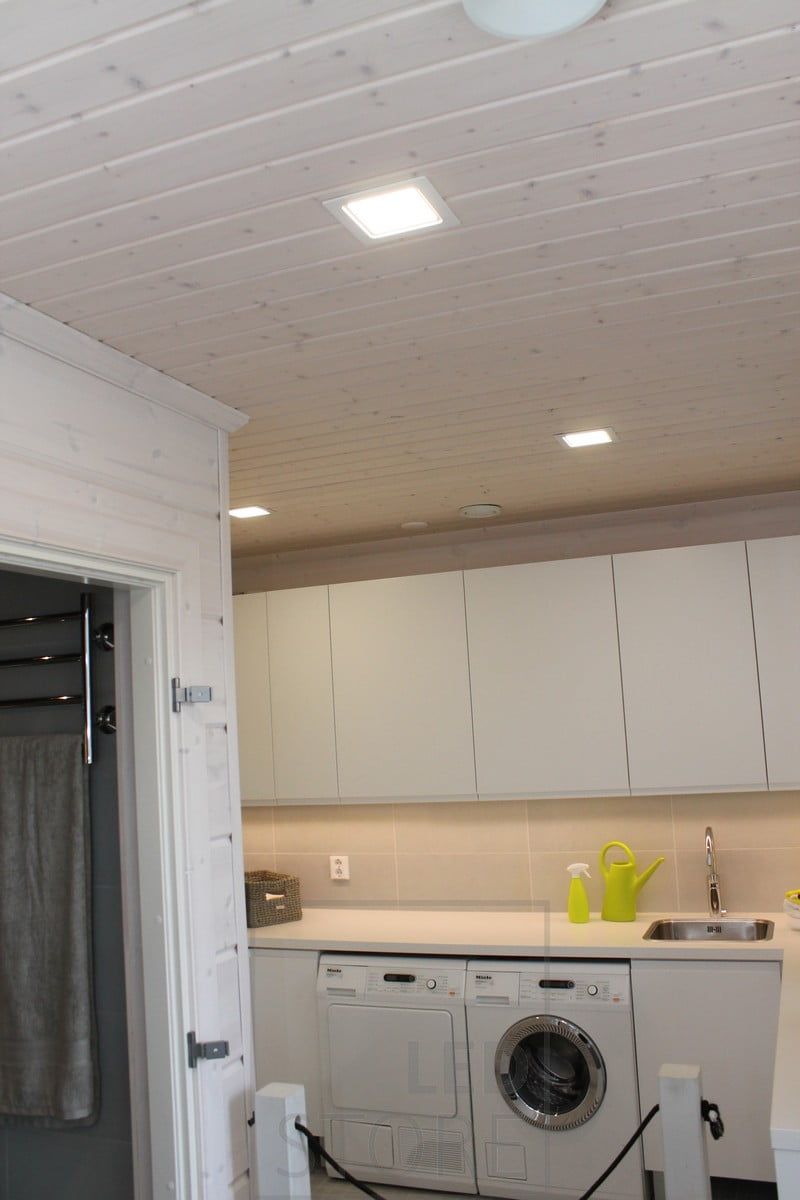 In the utility room, LED strip light on the worktop, small but widely illuminating panel lights on the ceiling